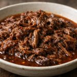 Slow-cooked shredded beef in a rich, lightly spicy barbacoa-style sauce made without sugar or starch, perfect for low-carb meals.