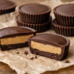 Chocolate cups filled with a thick peanut butter center, formed in layers and set into a firm, bite-sized shape.