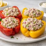 Bell peppers filled with a creamy tuna mixture, served cold with a firm, structured filling and crisp bite.