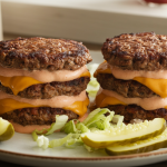 Thin, crispy-edged beef patties stacked with melted cheese and finished with a thick, tangy special sauce.